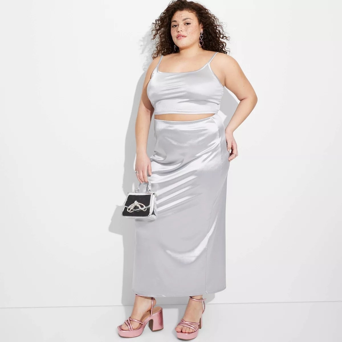 Model wearing silver satin high-rise maxi skirt