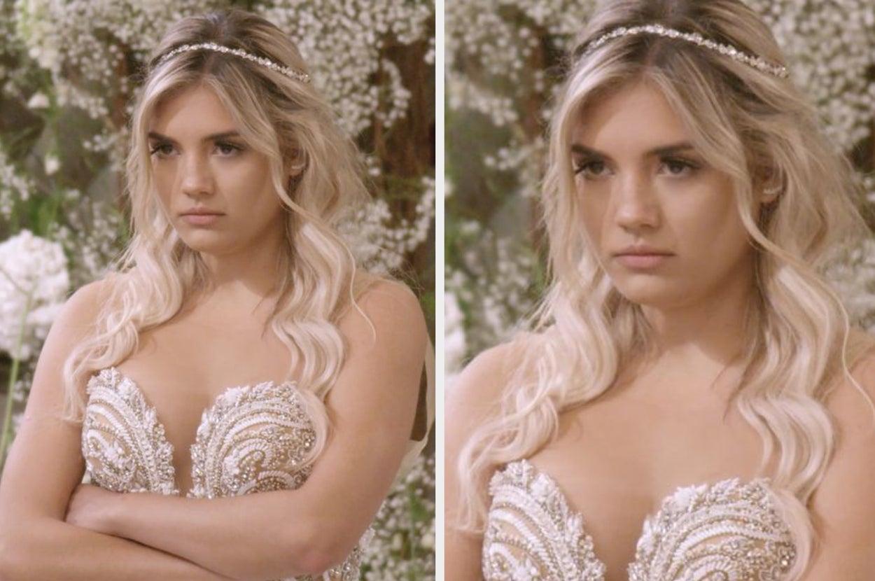 Person in beaded dress with a tiara, looking pensive