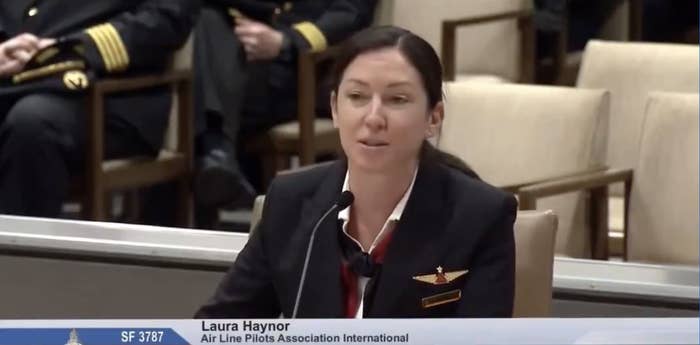 Haynor, in a pilot uniform, speaking at a podium with a nameplate that reads, &quot;Laura Haynor, Air Line Pilots Association International&quot;