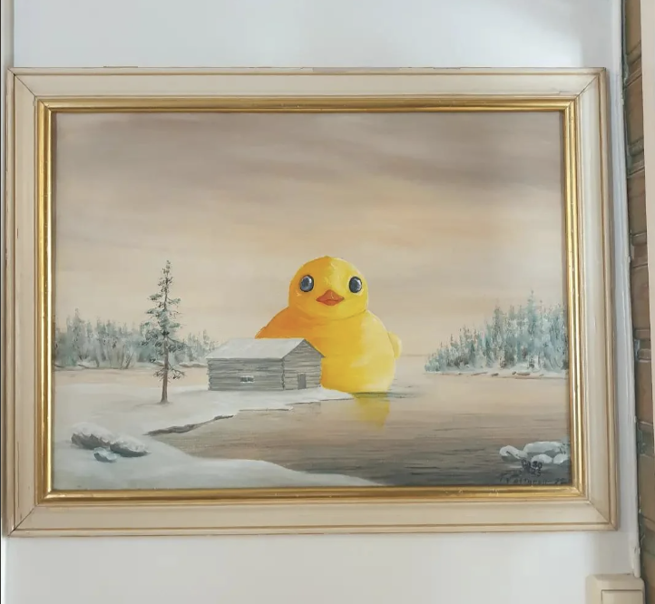 Framed painting of a cheerful cartoon duck in a winter landscape with a cabin and trees