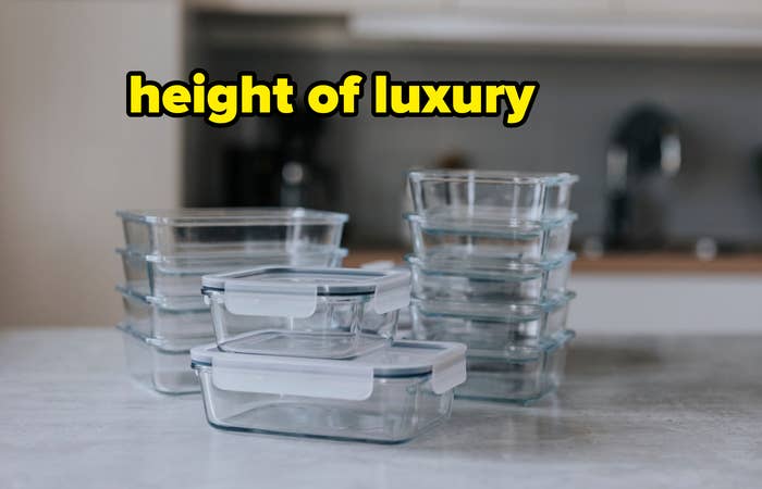 Assorted sizes of empty glass food storage containers on a kitchen counter