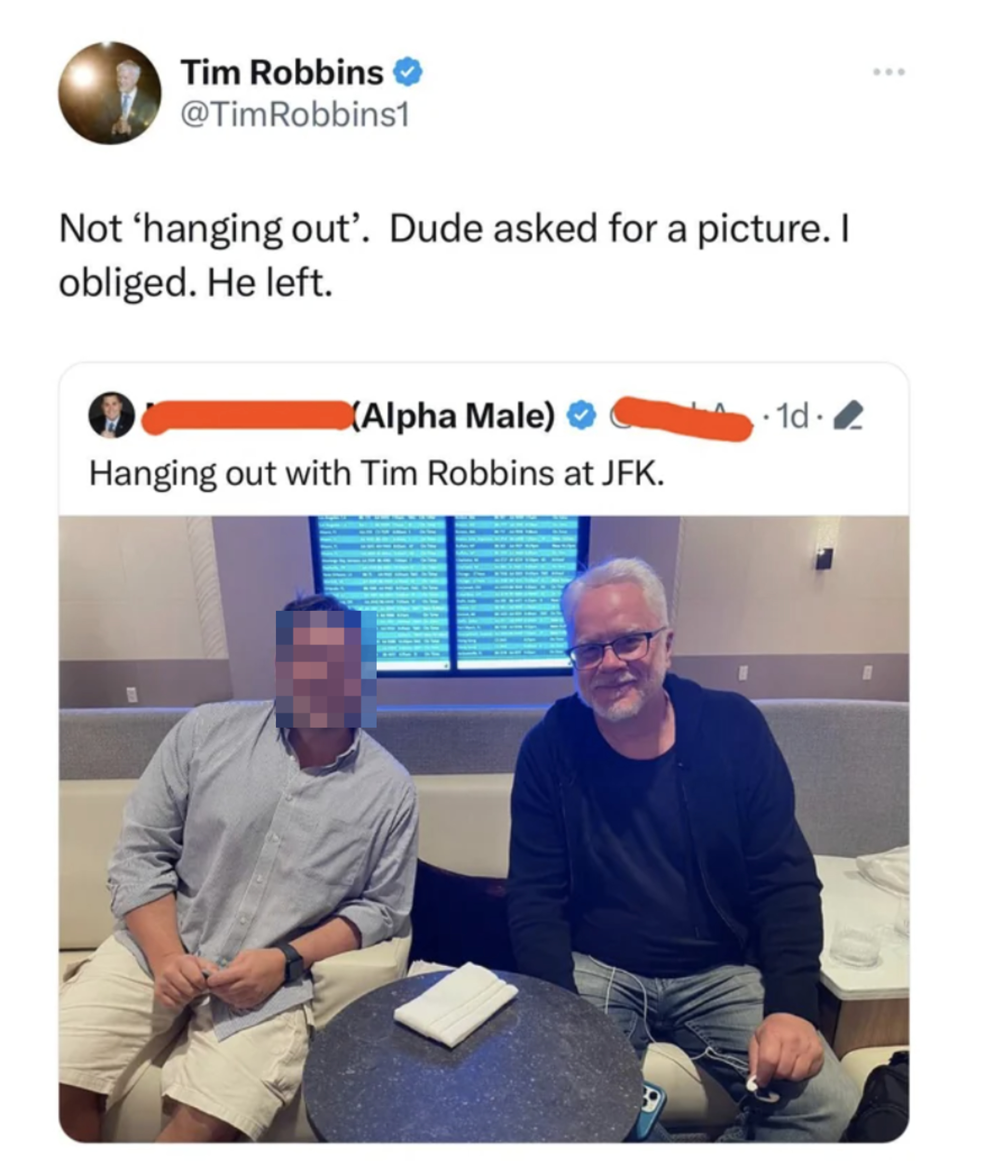 Tim Robbins and a fan seated together, smiling for a photo. Robbins is mentioned as an &quot;Alpha Male&quot; in the overlaid tweet