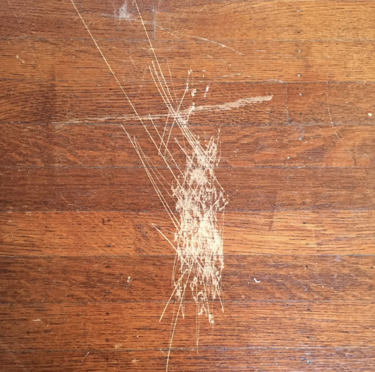 Close-up of scratched wooden flooring