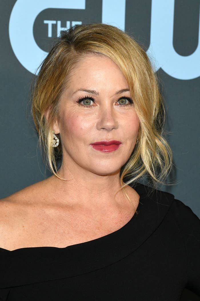 Christina Applegate wearing an off-shoulder black dress at an event