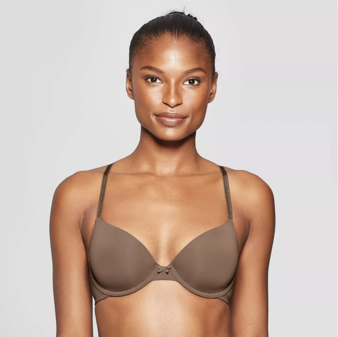 model wearing a plain, smooth-cupped bra