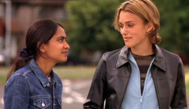 Two characters from &quot;Bend It Like Beckham&quot; stand side by side, engaged in conversation