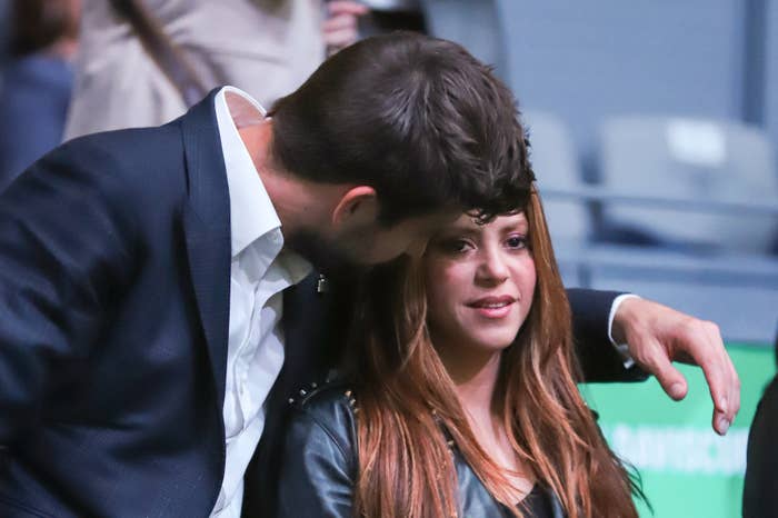 Closeup of Gerard Piqué with his arm around Shakira&#x27;s shoulders