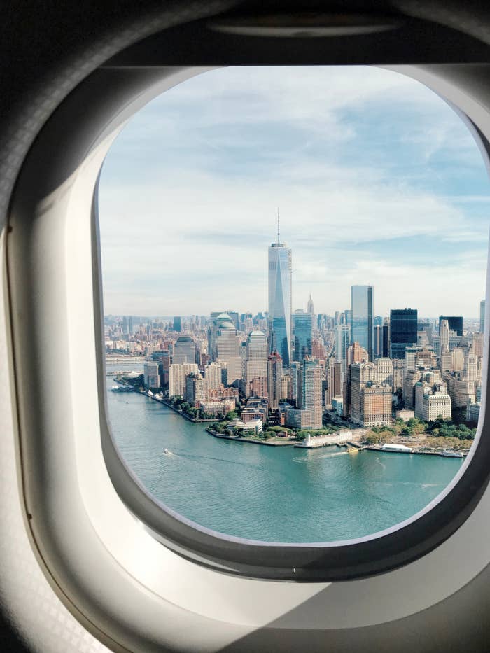 View of a city skyline through an airplane window