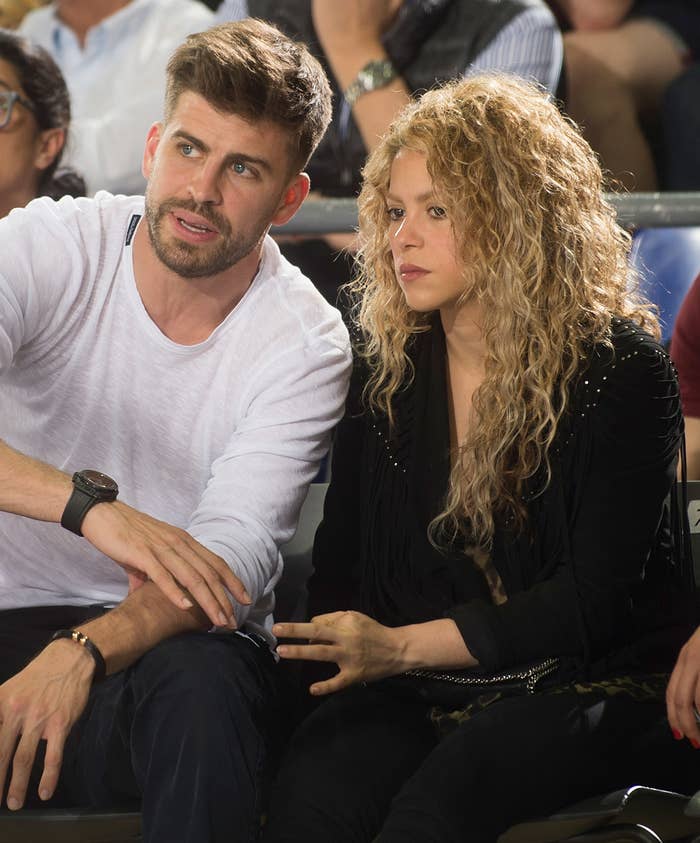 Closeup of Gerard Piqué and Shakira sitting at an event