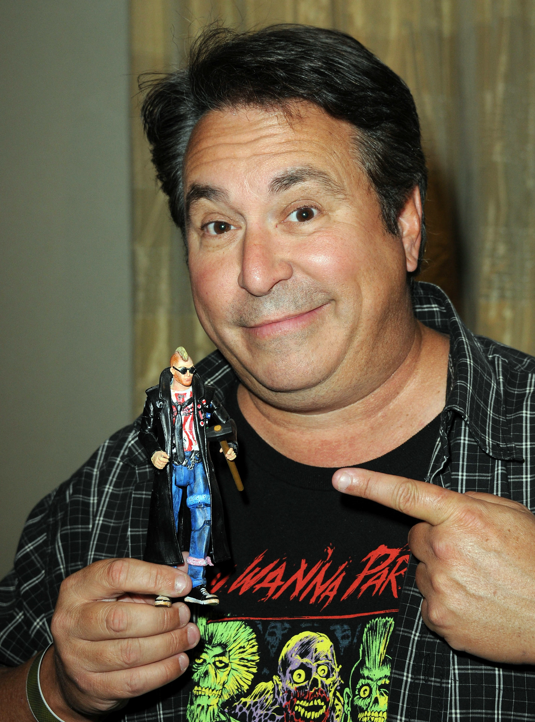 Closeup of Brian Peck holding a toy figurine