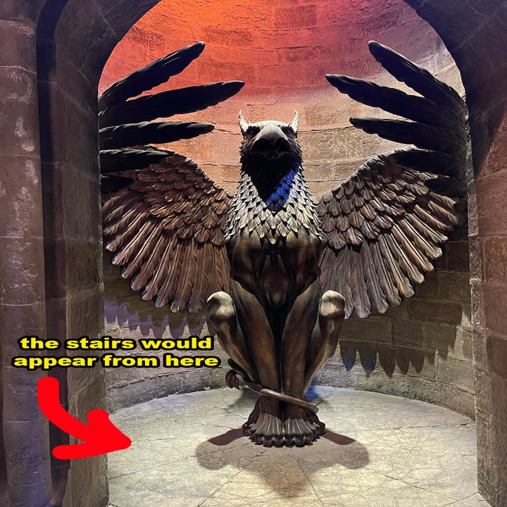 Sculpture of an eagle with wings spread in an arched alcove, text overlay indicates where stairs would appear