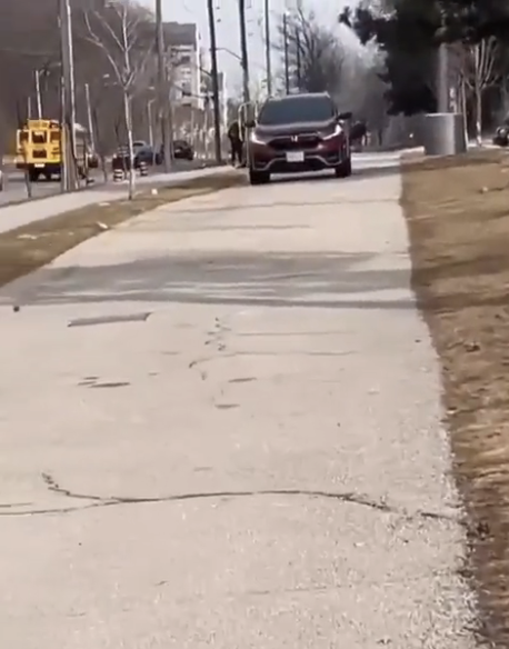 A truck driving on a sidewalk