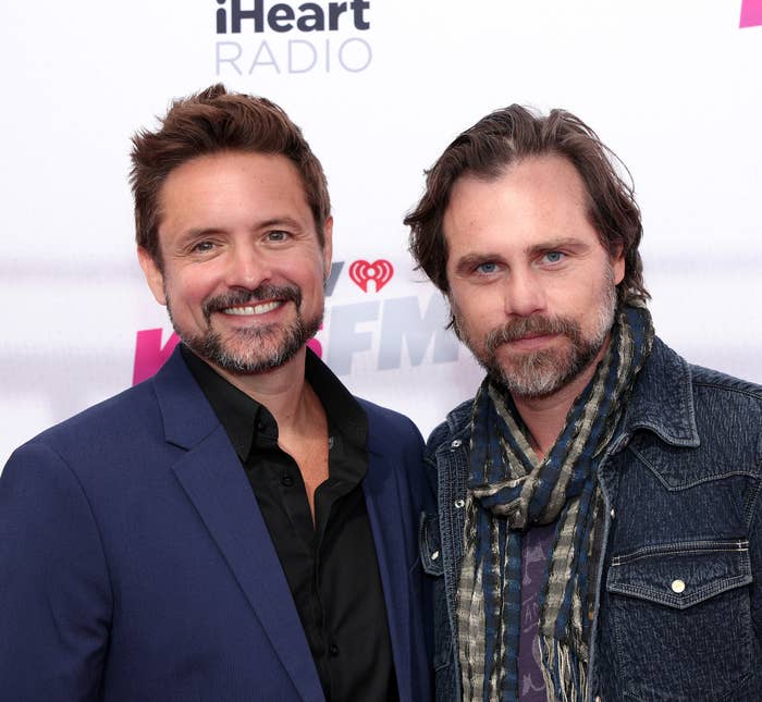 Closeup of Will Friedle and Rider Strong on the red carpet of a media event