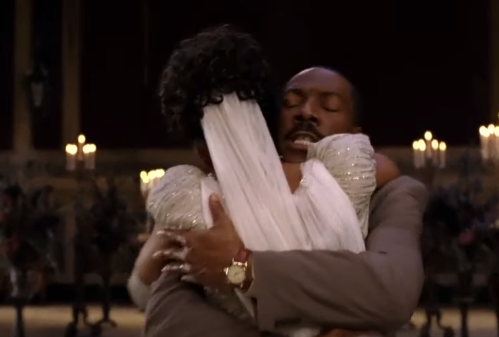 Eddie Murphy and Shari Headley hugging in a scene from &quot;Coming to America&quot;