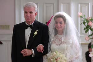 Steve Martin and Kimberly Williams in "Father of the Bride" walking down the aisle; he's in a suit, she's in a lace wedding dress