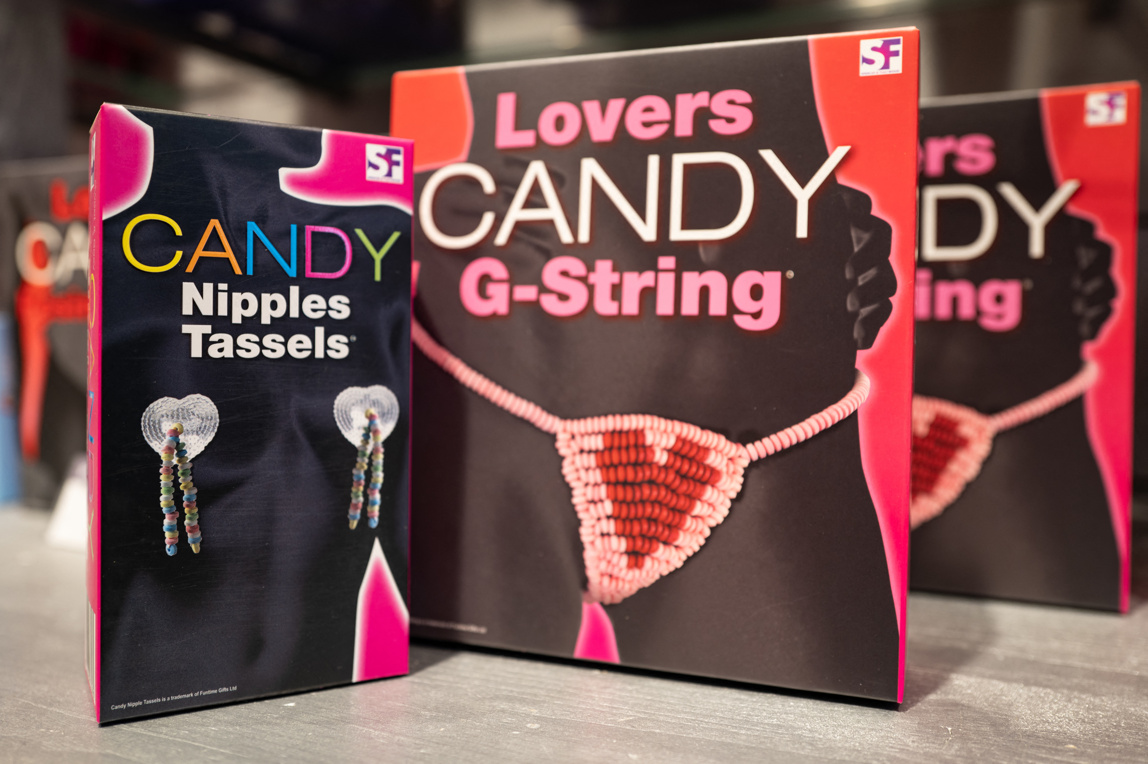 Product packaging for &quot;Lovers Candy G-String&quot; and &quot;Candy Nipples Tassels&quot; on display