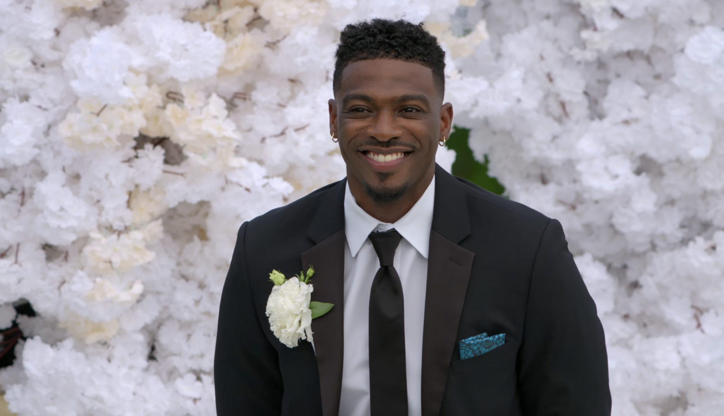 Clay smiling at the altar during his wedding