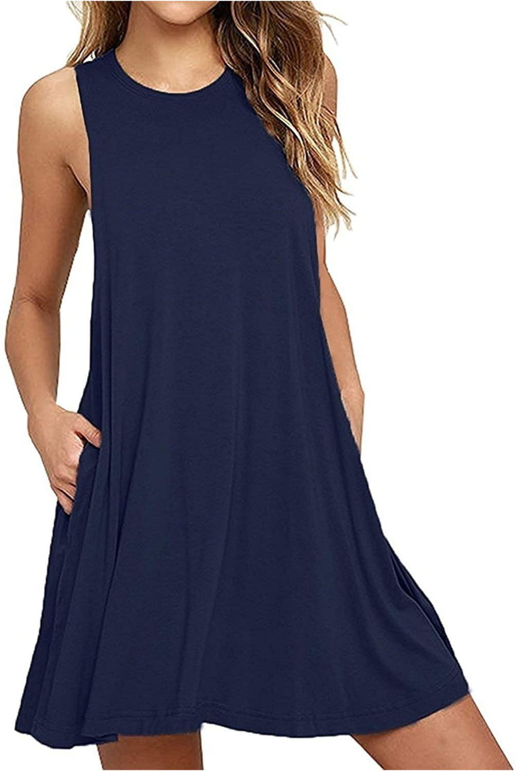 model in a casual sleeveless navy dress standing, partial view
