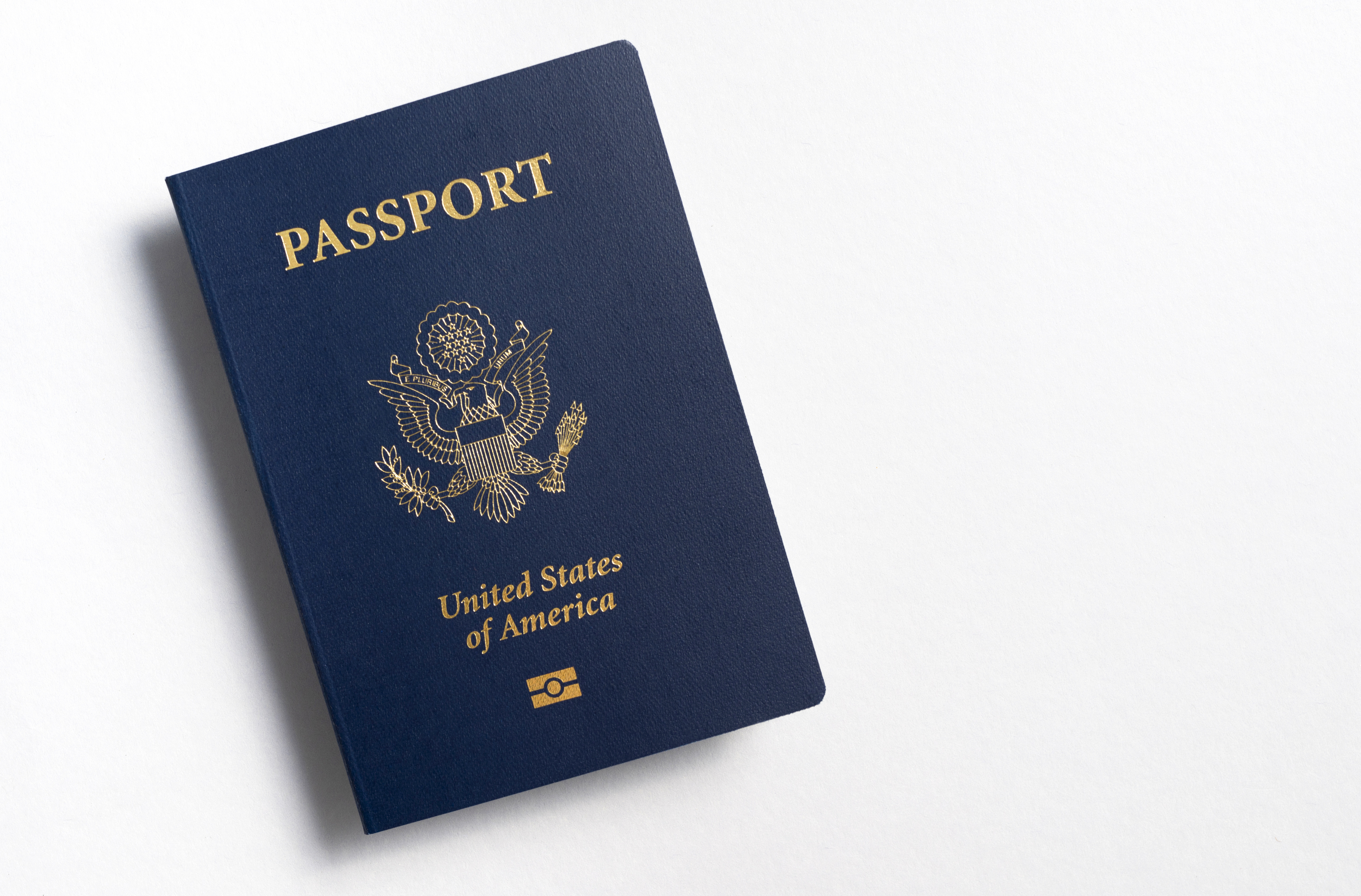 U.S. passport resting on a white surface