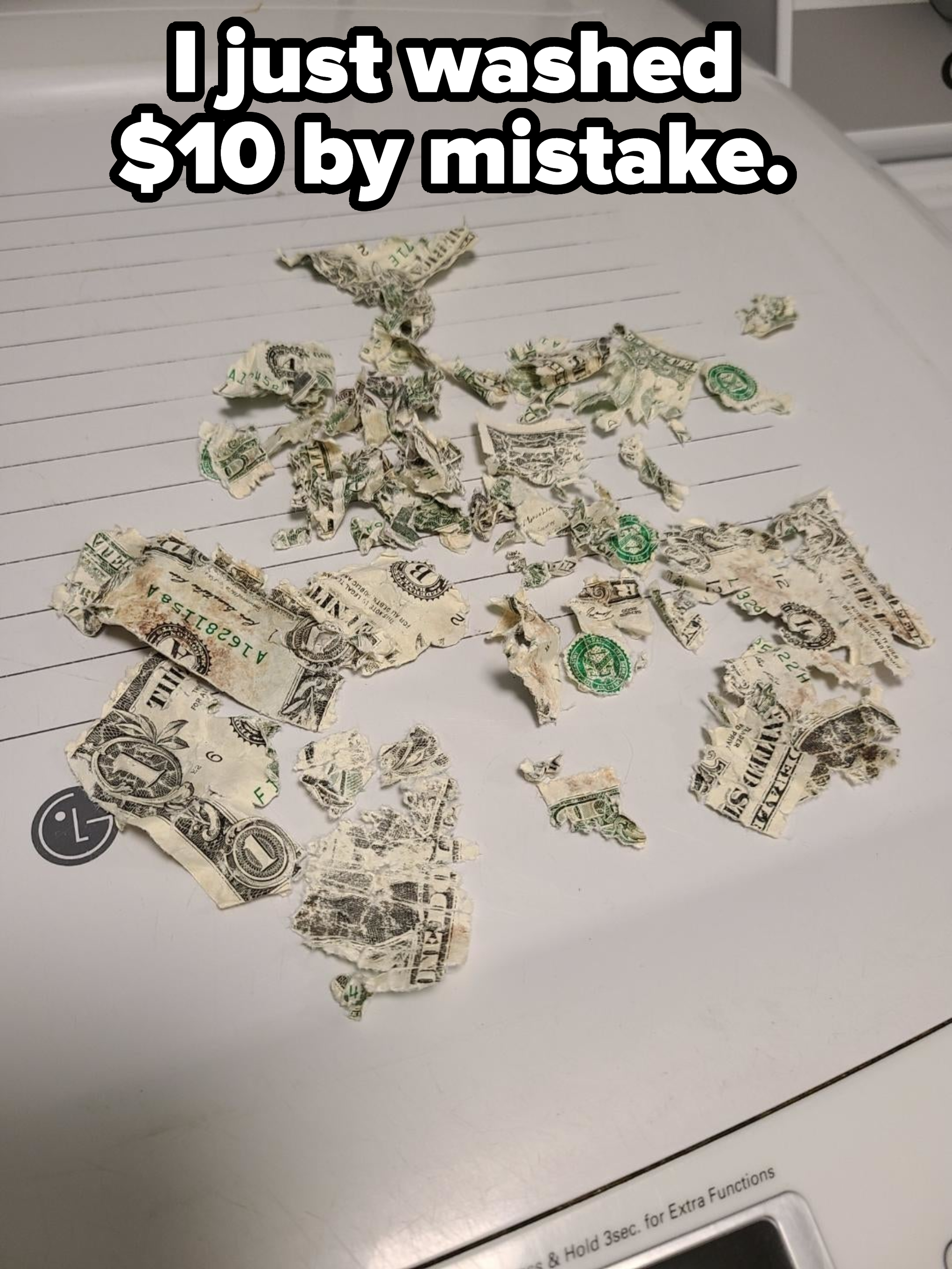 Shredded US dollar bills scattered on a white surface