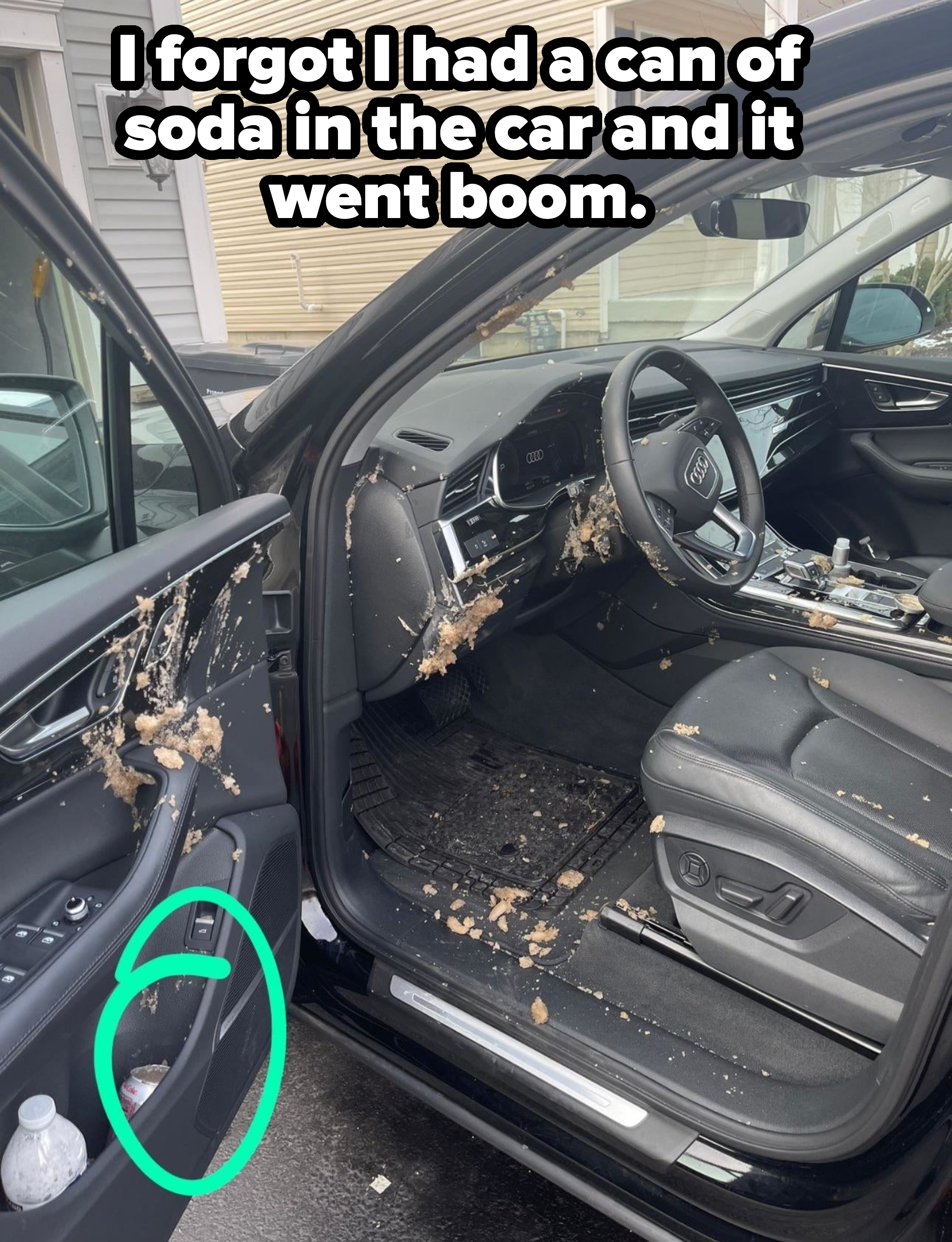 A car interior with soda spattered all over the front seat, driver&#x27;s side, steering wheel, and door