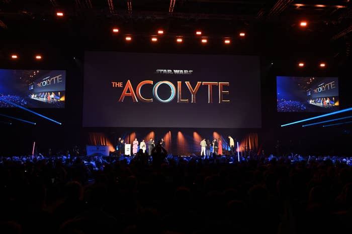 Stage event reveal of &#x27;The Acolyte&#x27; with people on stage and audience watching
