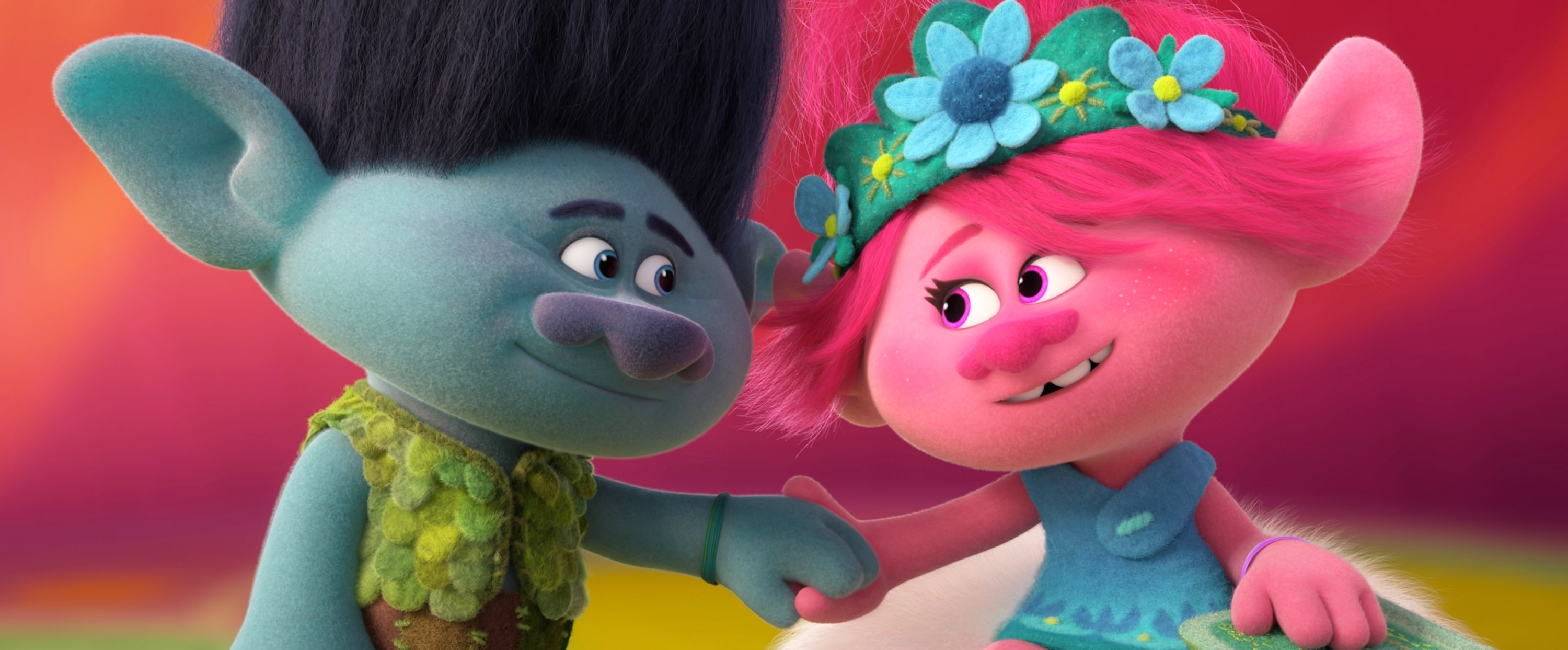 Branch and Poppy from Trolls, smiling, shaking hands, adorned with floral accessories
