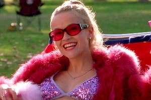 Elle Woods smiling in a sparkly pink bikini and a pink fur coat.