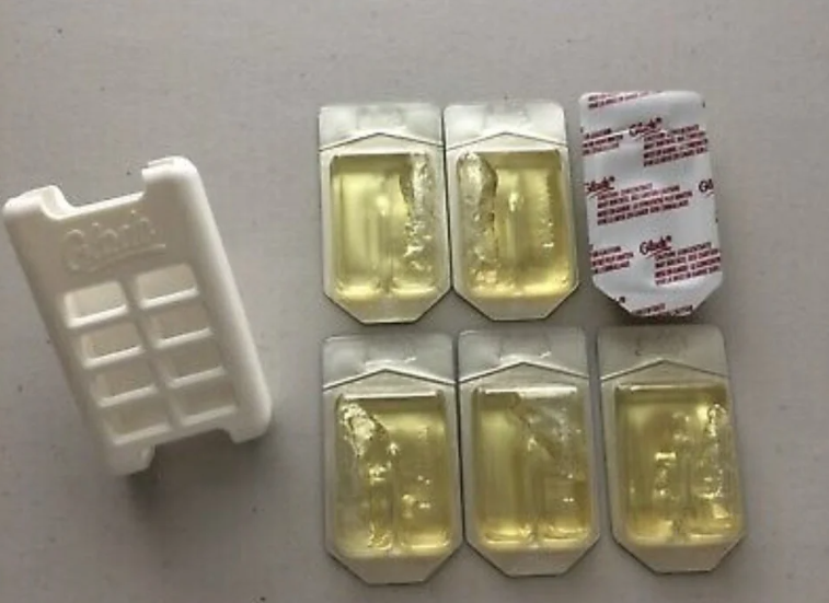 Six open cold medicine blister packs with remaining medicine and one empty pack