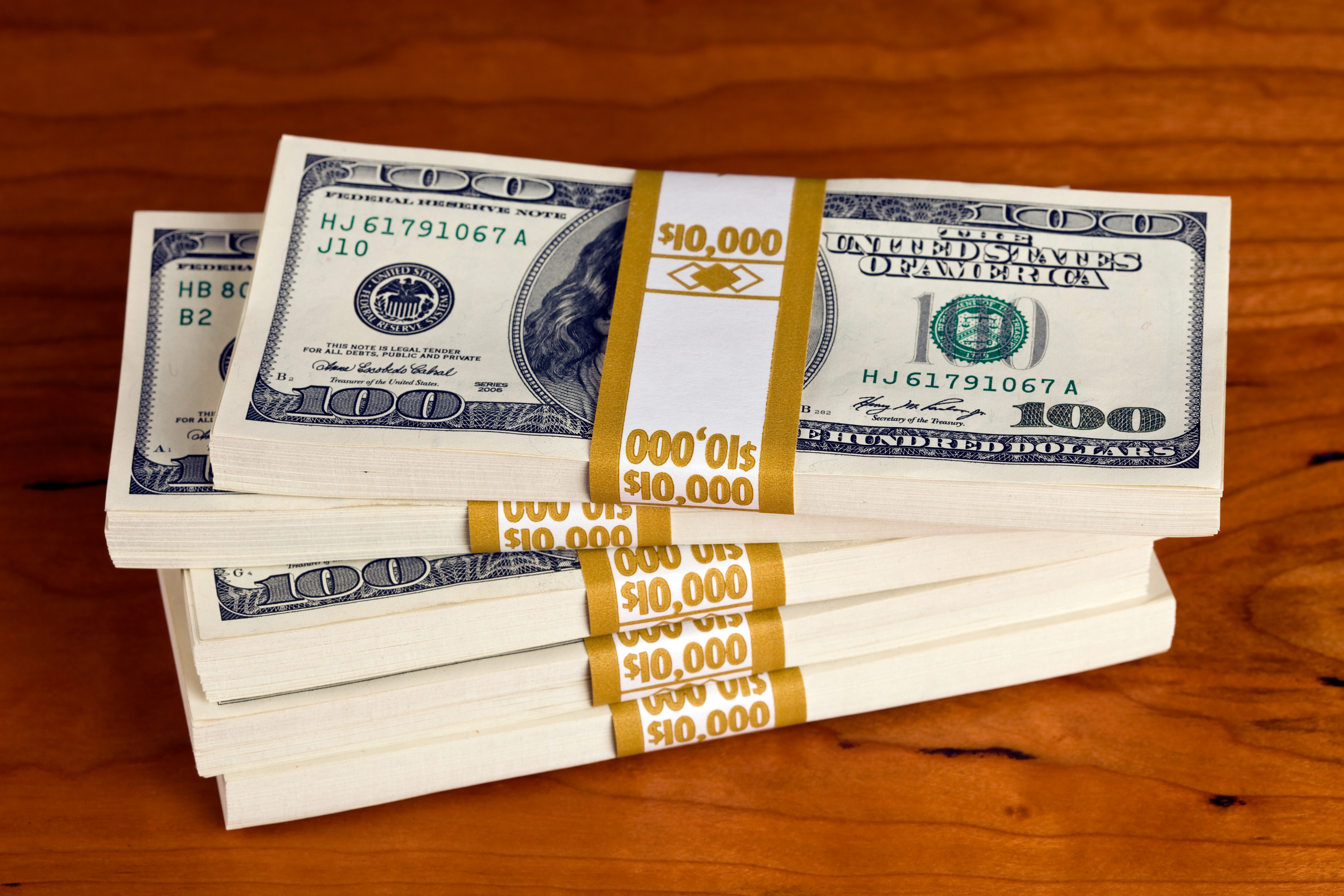 Stacks of US $100 bills banded