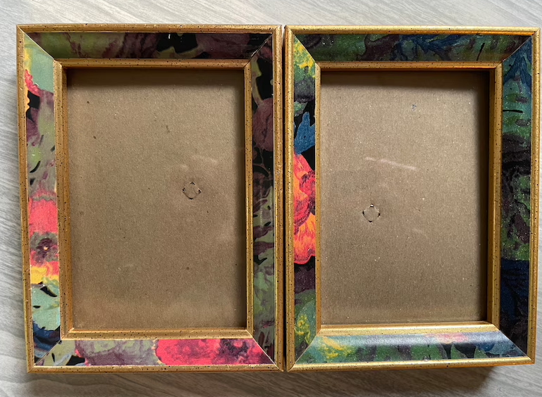 Two empty picture frames with multicolored abstract patterns on the borders