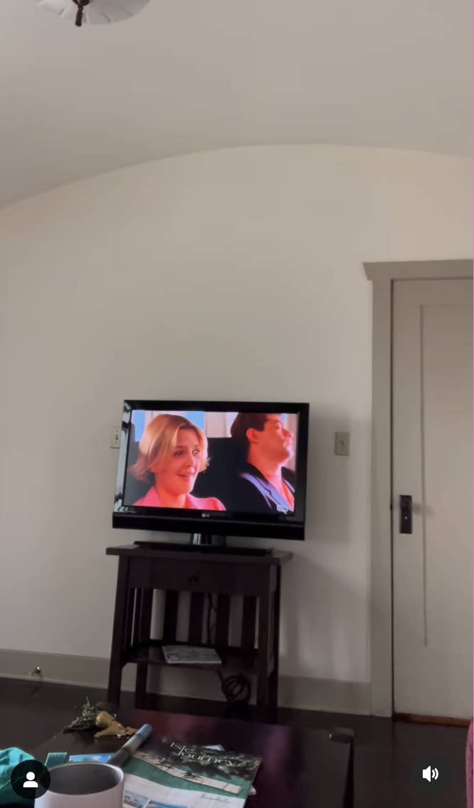 Television screen showing a scene from The Wedding Singer, in a living room setting