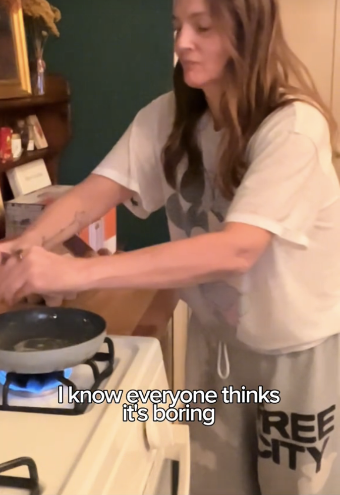 Drew Barrymore cooking in a kitchen