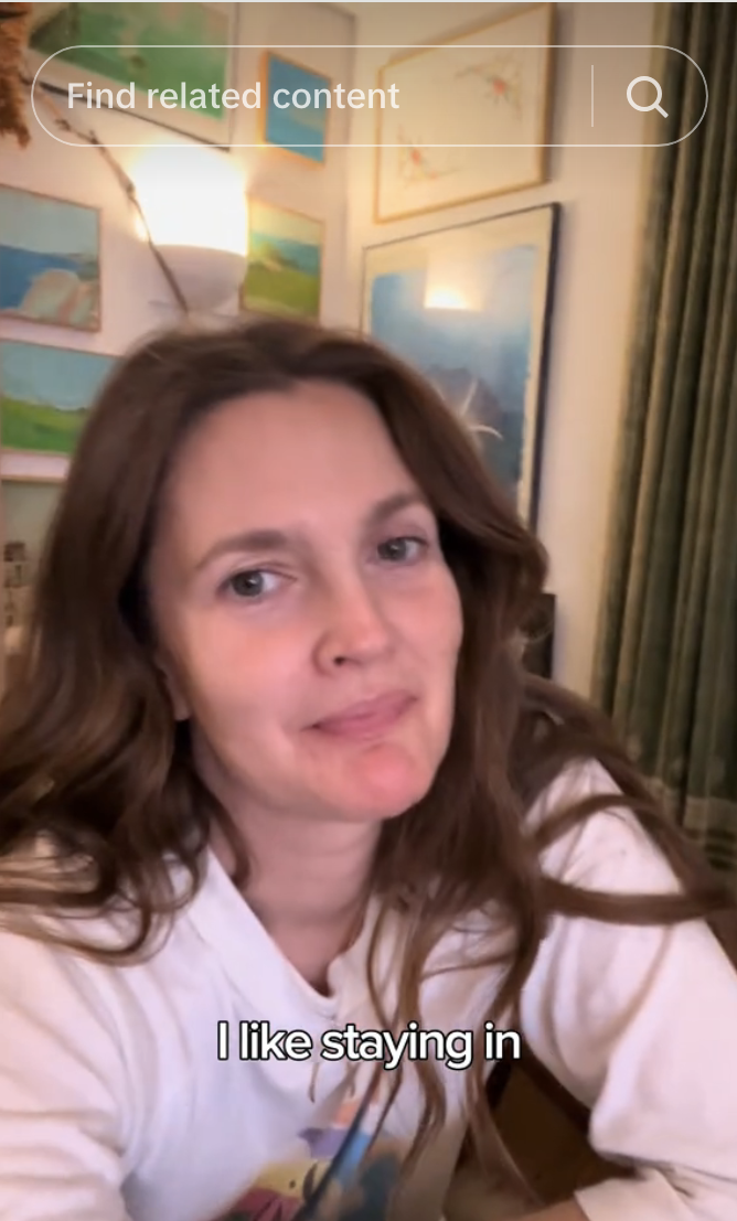 Drew Barrymore in a casual video, no detailed clothing visible