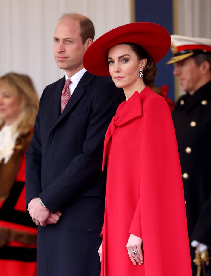 William and Kate standing side by side at a formal event