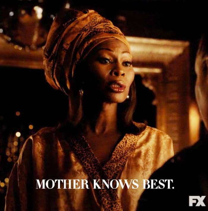 Character from a show wearing a head wrap and patterned robe with text &quot;MOTHER KNOWS BEST.&quot;