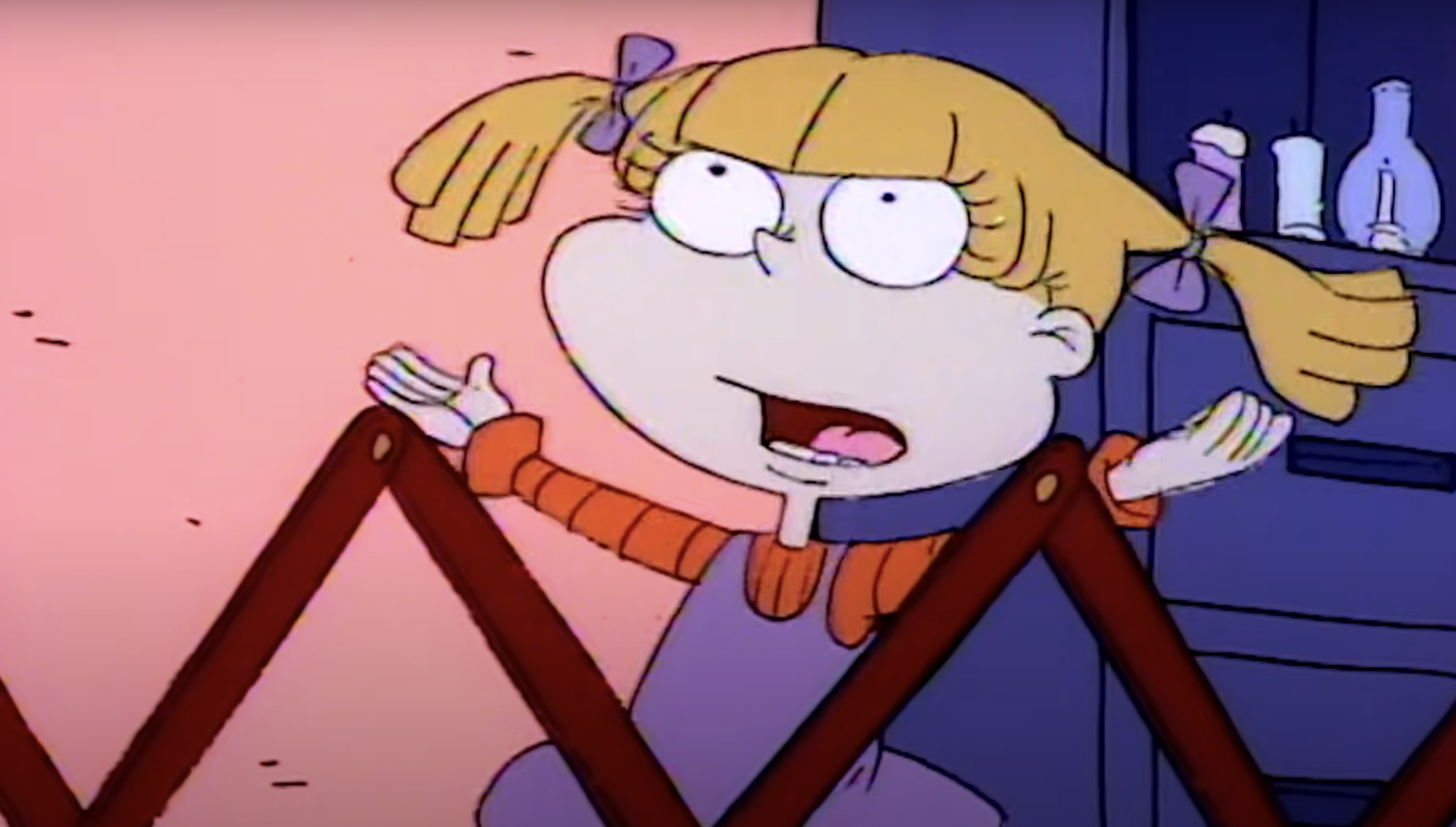 Character Angelica from the animated series &#x27;Rugrats&#x27;, looking frustrated while standing in a playpen
