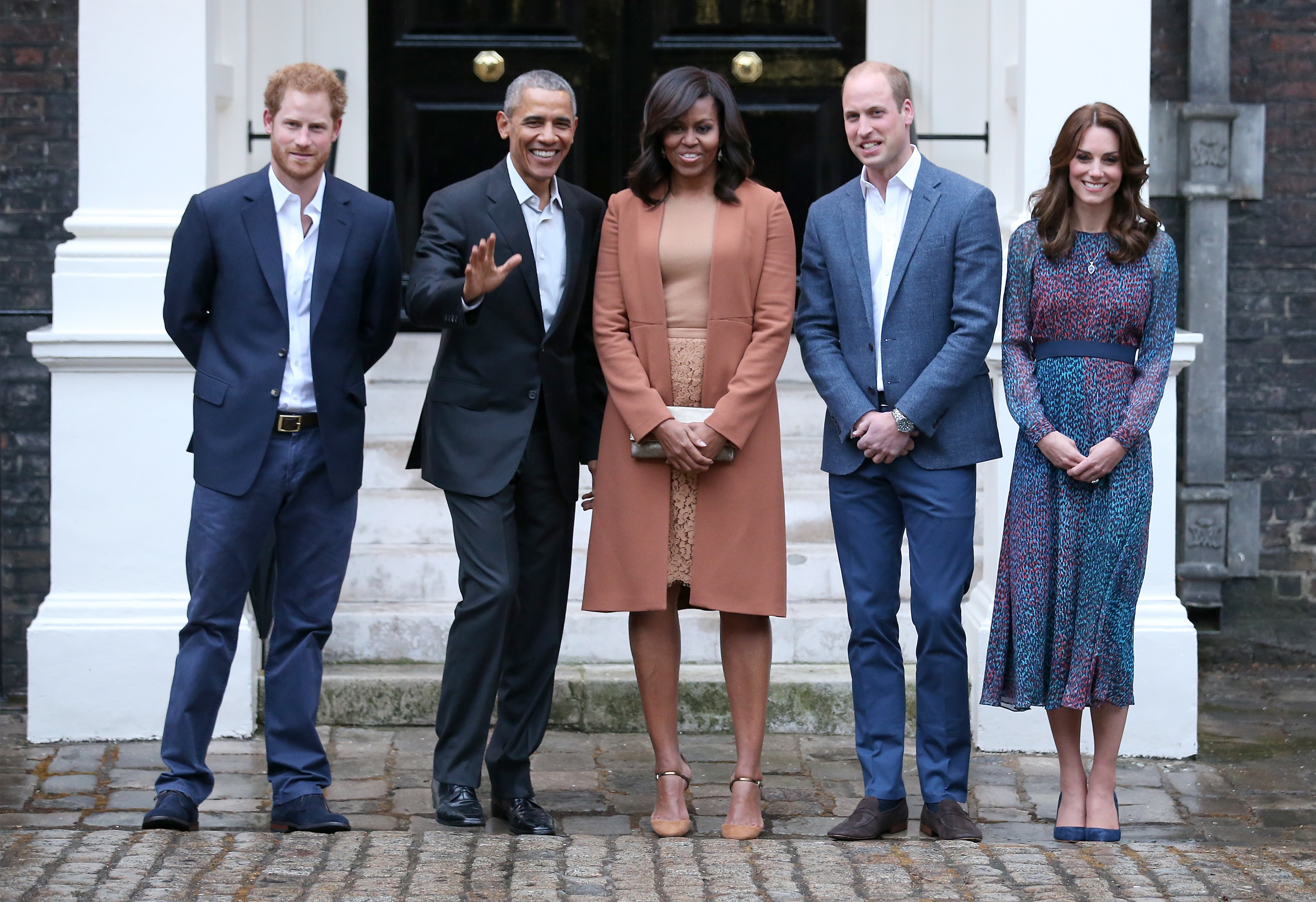 Prince Harry, Barack Obama, Former First LadyMichelle Obama, Prince William, and Catherine, Duchess of Cambridge pose together for a photo, dressed semi-formally