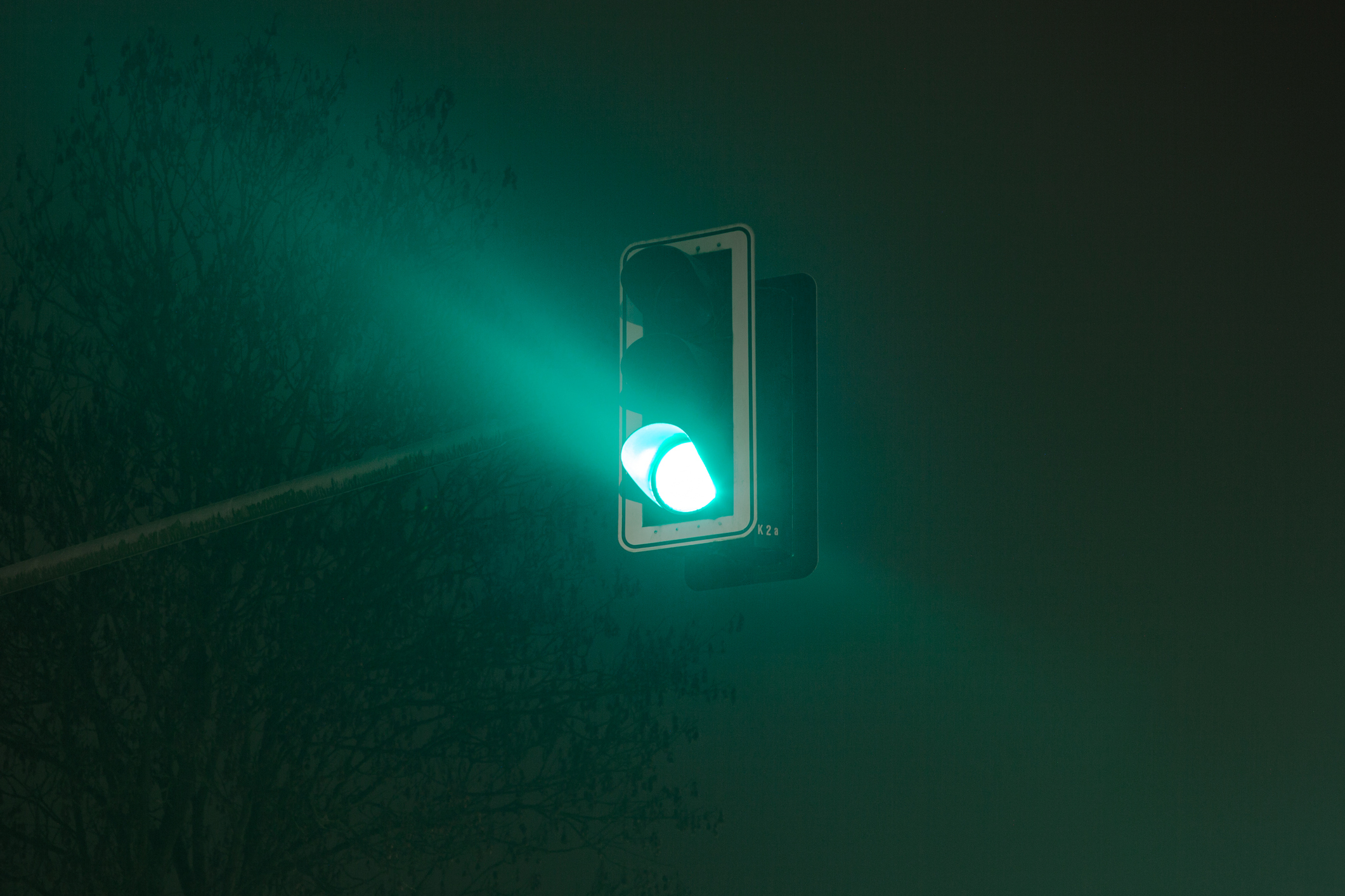 Traffic light on green at night