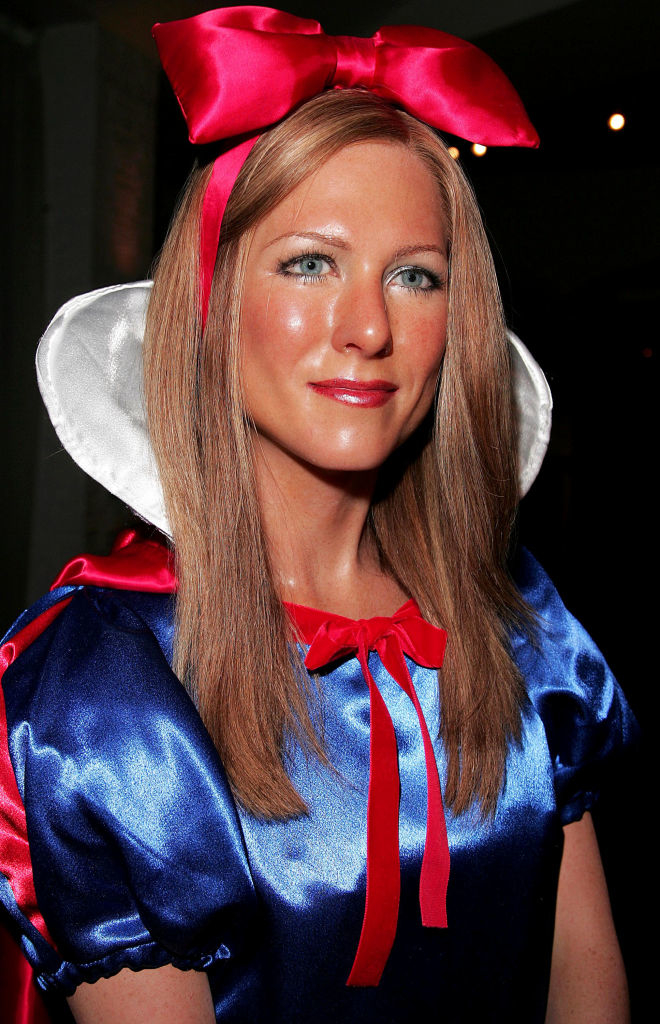 Jennifer Aniston&#x27;s wax figure with a large red bow headband