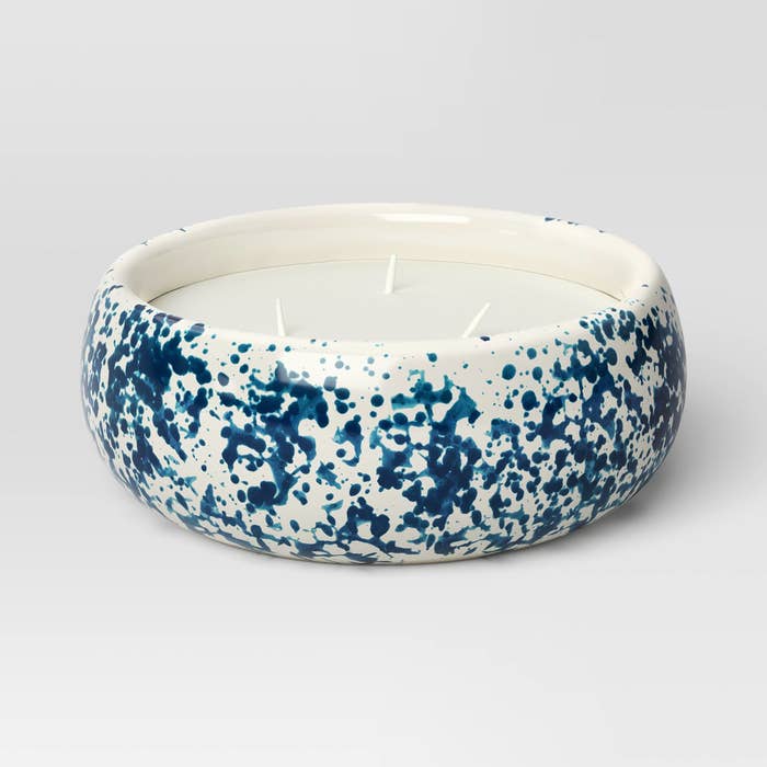 A ceramic bowl with blue splatter design