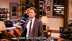 Barney Stinson from &quot;How I Met Your Mother&quot; smiling in a suit, captioned with his love for spicy food