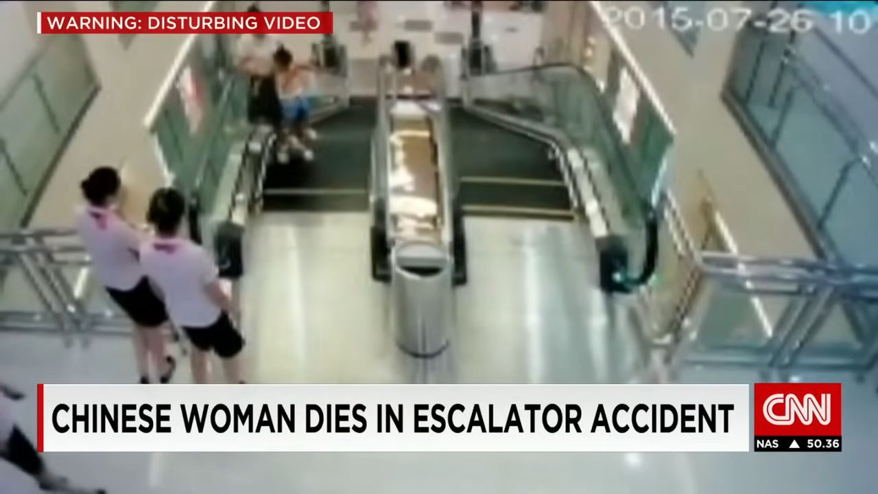 Security camera footage showing people on an escalator, with a CNN headline about an accident