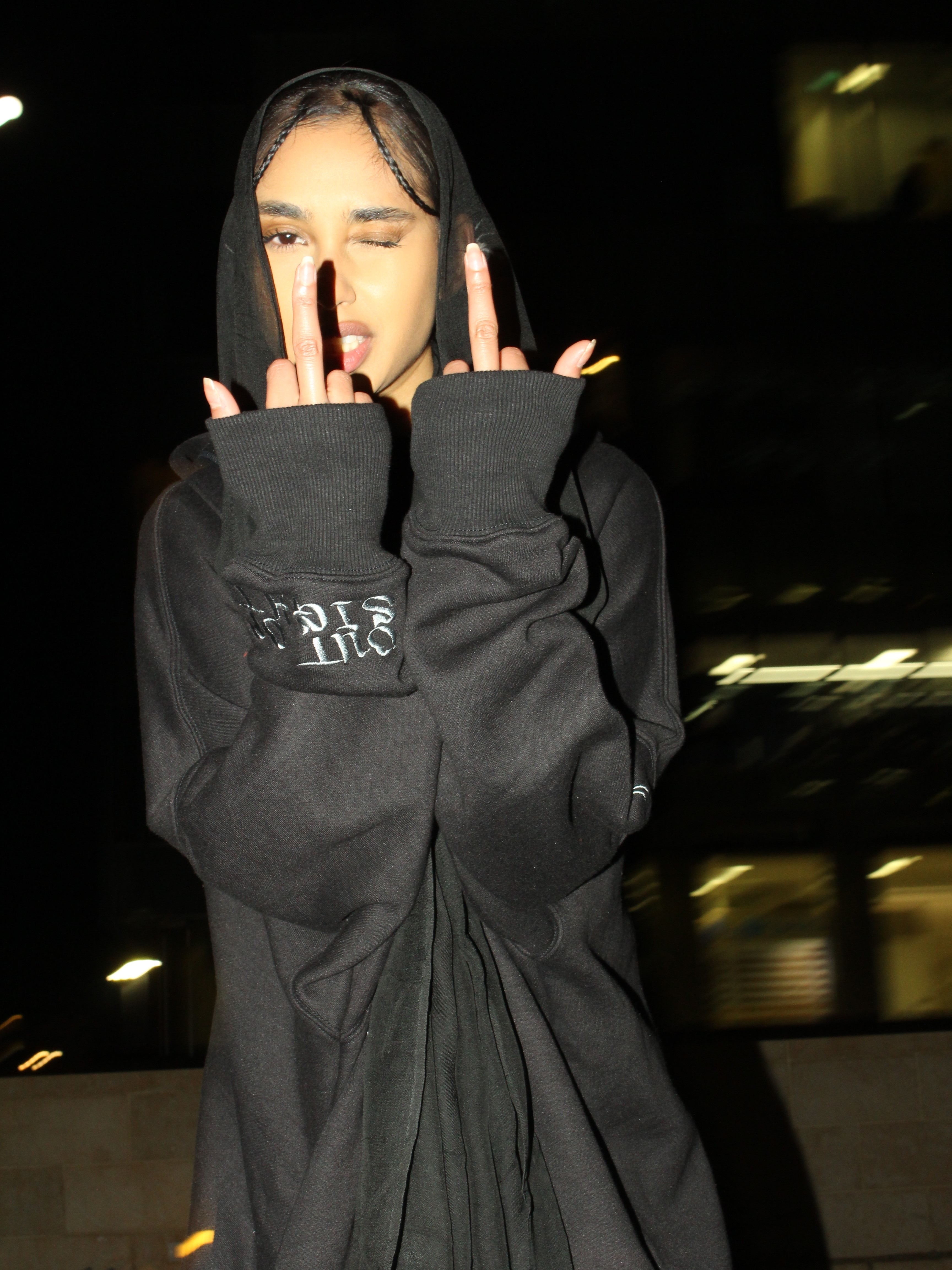 Saeedah in a black hoodie abaya with a hijab