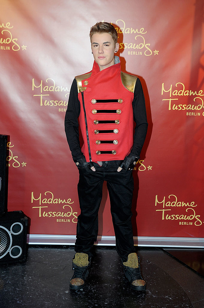 Wax figure of Justin Bieber in a military-style jacket and pants at Madame Tussauds