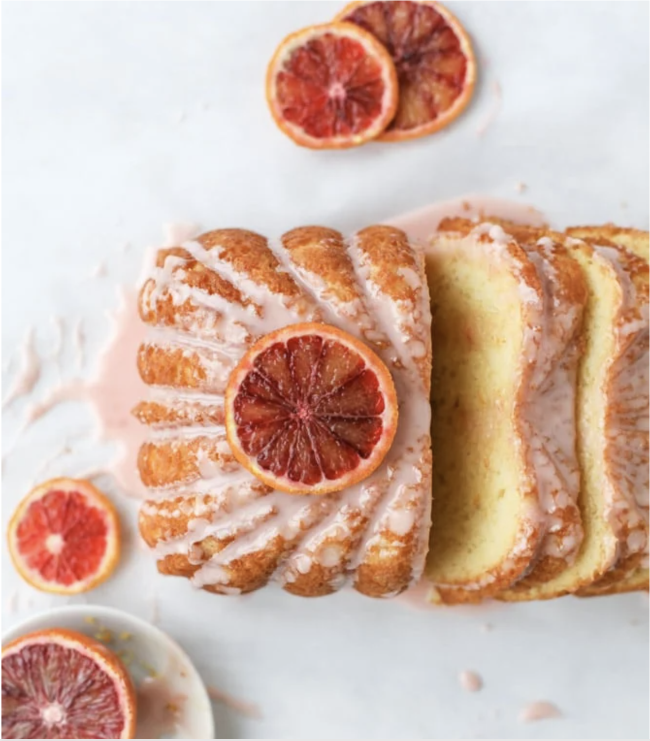 Sliced citrus pound cake with glaze and blood orange slices on top
