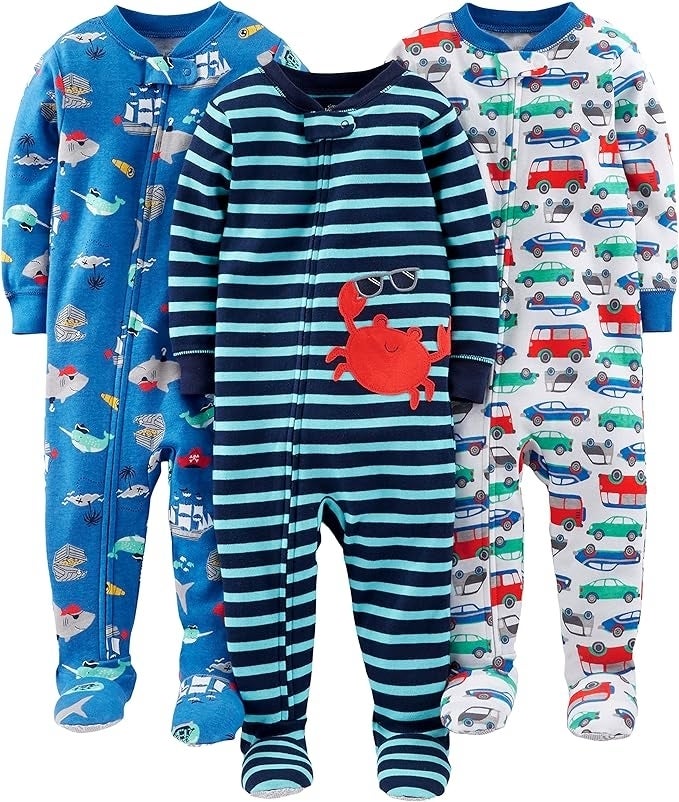 Three antithetic  patterned babe  onesies with footies