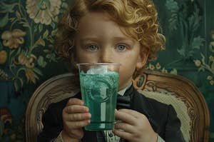 Victorian child in formal attire holding a Baja Blast from Taco Bell