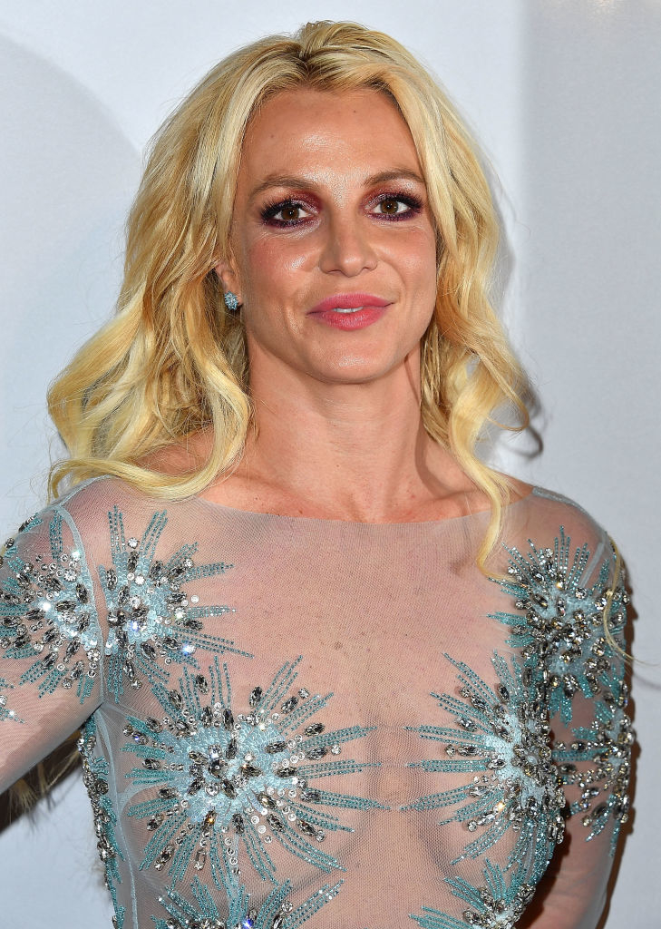Britney Spears wearing a sheer dress with sparkly silver embellishments