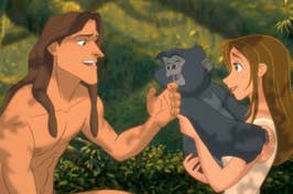 Animated characters Tarzan and Jane share a playful moment, with Tarzan teaching Jane to speak to a gorilla
